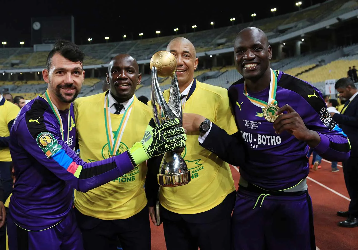 Sundowns celebrating a CAF Champions League title with the trophy