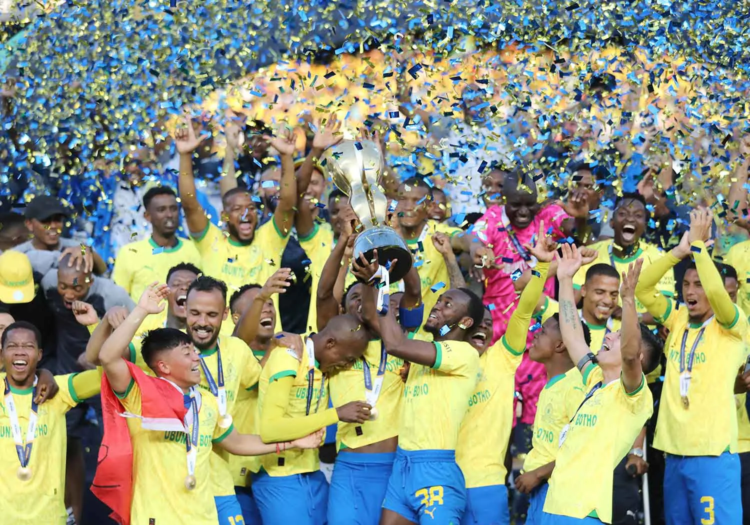 Sundowns celebrating a league title under blue and gold confetti