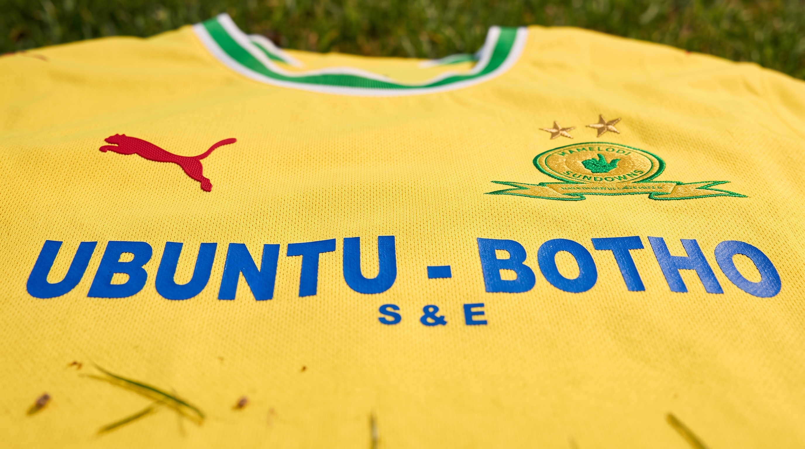 Detail of the 2026/27 Mamelodi Sundowns shirt, crest and two gold stars