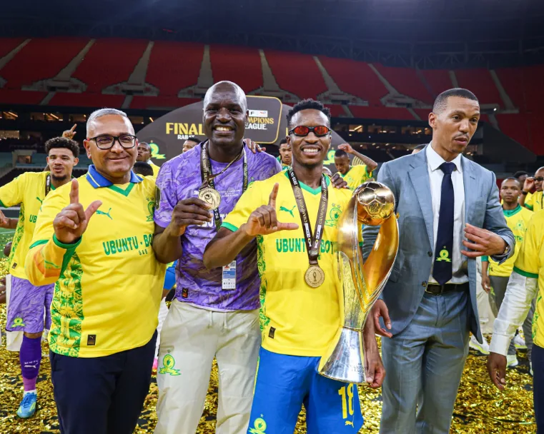 Mamelodi Sundowns players and officials celebrating the club's second CAF Champions League title in 2026