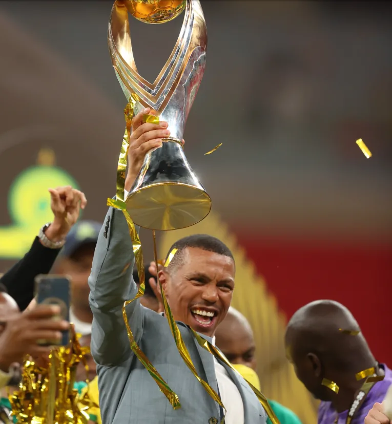 Mamelodi Sundowns Chairman Tlhopie Motsepe celebrating with the CAF Champions League trophy