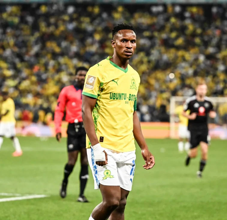 Themba Zwane in the Sundowns home kit during a match at a full stadium